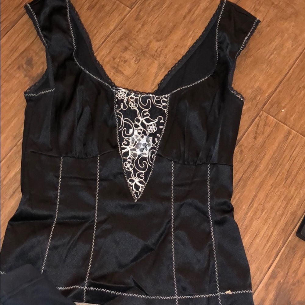 Half zips in back . never worn